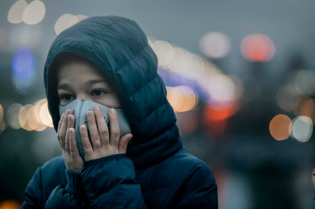 Air Pollution, Child in a City Street with Poor Air Quality